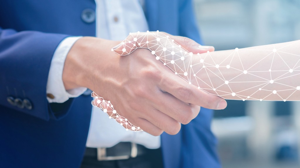 Business handshake with digital network overlay, symbolising trusted IT consulting partnerships on the Sunshine Coast.