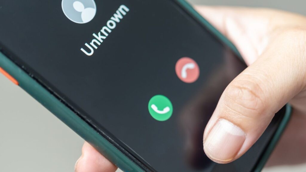 Smartphone showing an incoming call from an unknown number, highlighting the risk of phone scams in Australia.