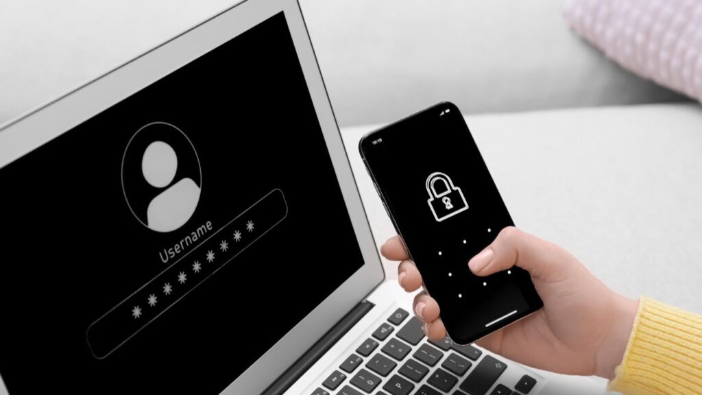 Business user logging in with a laptop and smartphone, showing password protection and multi-factor authentication for cybersecurity.