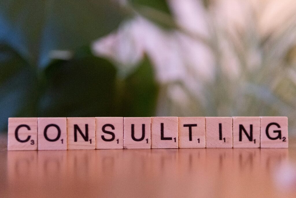 Wooden Scrabble tiles arranged to spell ‘CONSULTING’, symbolising expert IT consulting services for Australian businesses.